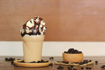 ice coffee and caramel smoothie on table in coffee shop.