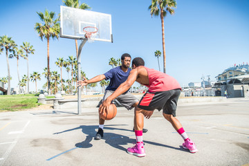 Friends playing basketball