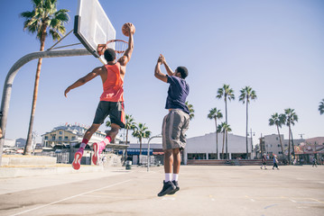 Friends playing basketball