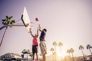 Friends playing basketball