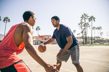 Fototapeta premium Friends playing basketball