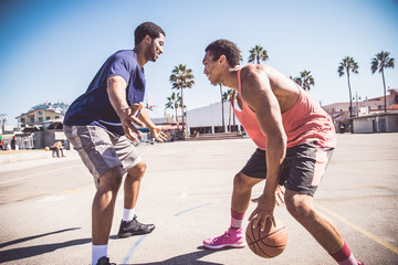 Fototapeta premium Friends playing basketball