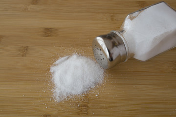 salt sprinkled on wooden table