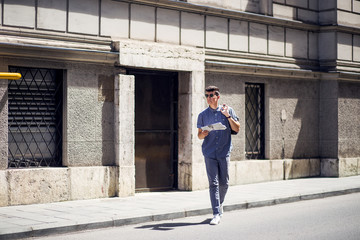 Young and modern business man crossing the street