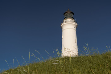White Lighthouse, Hirtshals Fyr, with blue sky in the dunes, Hirtshals in North Jutland, Denmark