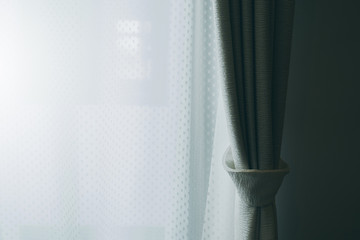 soft brown curtain with morning light from window bedroom background