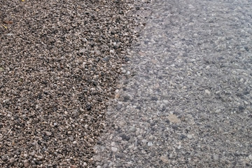 Wave breaker on the beach at sunny day.