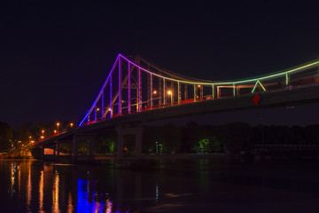 Fototapeta na wymiar Kiev Ukraine pedestrian bridge evening illumination travel