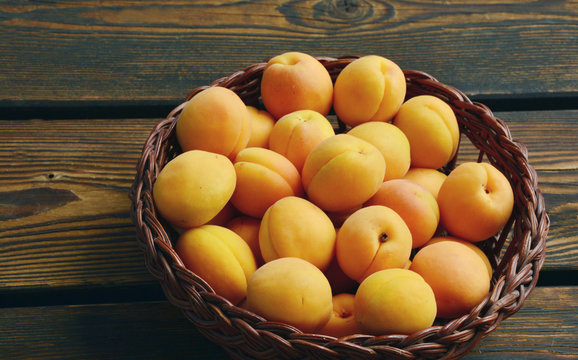A lot of Apricots in basket.