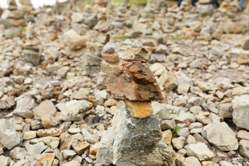 Stones stacked one on the other. Instalation near the Memorial naval aviation Cape of the Goat, France