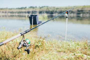 Fishing tackle - fishing spinning, hooks and lures on darken wooden background