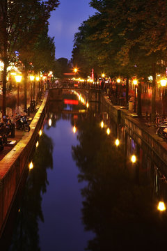 Embankment of canal at De Wallen - Red Light district. Amsterdam. Netherlands