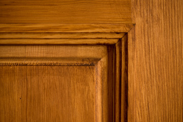 detail of a brown wooden door, wood carving