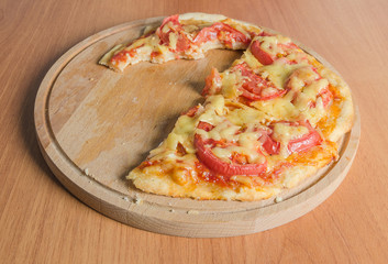 Bitten slice of a pizza