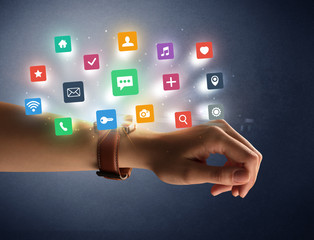 Naked female hand with smartwatch and  application labels around and dark background