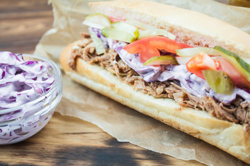 sandwich with pulled pork and cole slaw, close-up