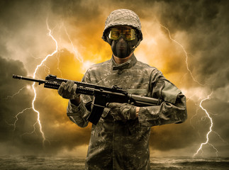 Armed soldier standing in rainy obscure weather
