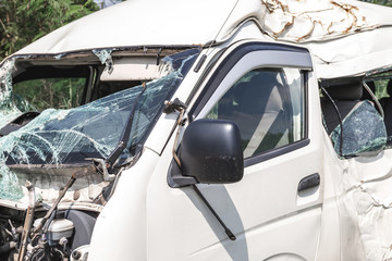 Fototapeta na wymiar Smashed minivan after serious car accident
