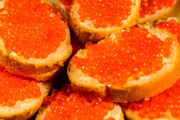 Background of the sandwiches with the red caviar