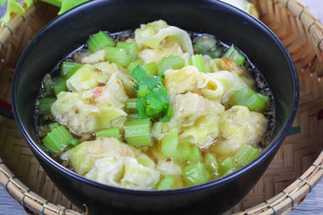 wonton clear soup with celery, traditional asian food