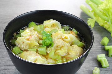 wonton clear soup with celery, traditional asian food