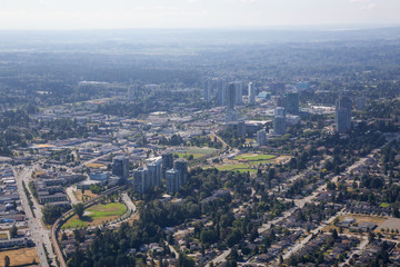 Fototapeta na wymiar Aerial city view of Surrey Central during a sunny summer day. Taken in Greater Vancouver, British Columbia, Canada.