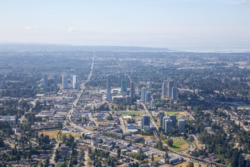 Fototapeta na wymiar Aerial city view of Surrey Central during a sunny summer day. Taken in Greater Vancouver, British Columbia, Canada.