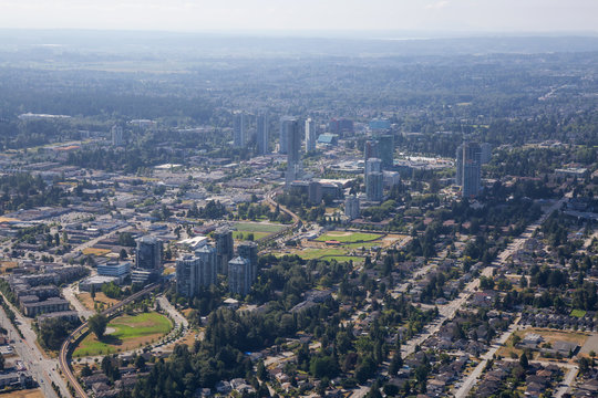 Aerial City View Of Surrey Central During A Sunny Summer Day. Taken In Greater Vancouver, British Columbia, Canada.