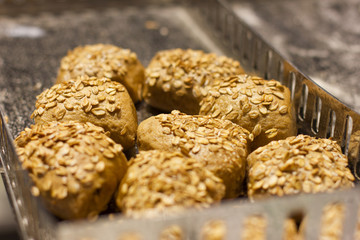 Fresh yeast rolls with oat flakes and cereals. Proper nutrition