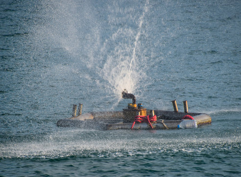 Sprinkler fountain in the sea. Sea fountain