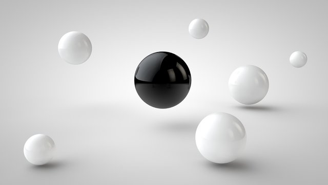 the image of groups of balls with different depth of field, white drop shadow, and randomly located in space, and one black ball in the center, on a white background. 3D rendering.