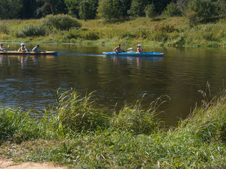 Fototapeta na wymiar kayaks floating down