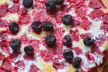 Cheesecake with raspberries and blackberry close-up. Light breakfast.