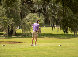 unknown golfer has landed a shot in the water hazard