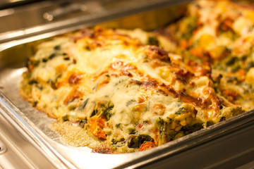 Vegetables graten with melted cheese, baked in the oven