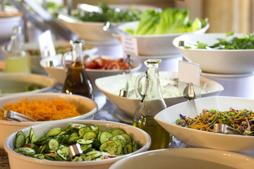 Salad bar in the hotel. Fresh cucumber, carrots and olive oi