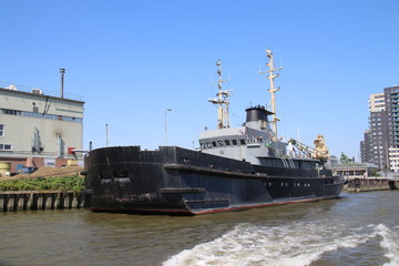 Fototapeta premium Inland freight ships on river Lek which transport seafreight to harbors in Germany and Switzerland.
