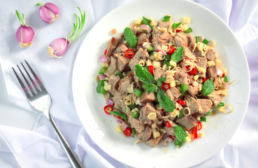 Spicy grilled pork salad with lemon grass and ginger