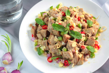 Spicy grilled pork salad with lemon grass and ginger