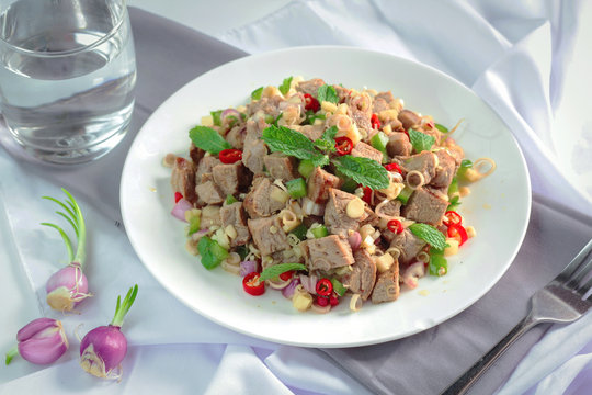 Spicy grilled pork salad with lemon grass and ginger