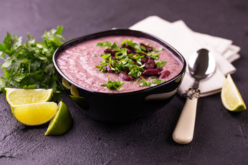 Mexican red bean puree soup with lime, parsley and chilli pepper.