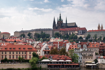 Obraz premium Citycentre of the capital city Prague, Czech Republic. View point from the Carles Bridge looking at the Saint Vit Cathedral and historical building in Mala Strana and Hradcany.