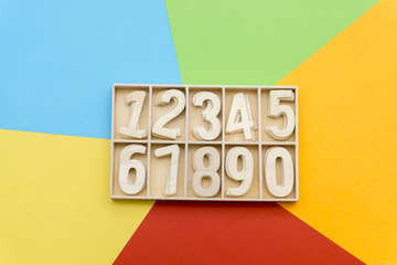 wooden numbers in the colorful background box