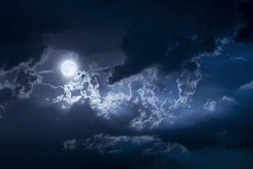 Dramatic Nighttime Clouds and Sky With Beautiful Full Blue Moon - 217493410