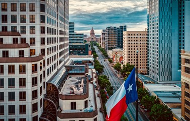 Texas Flag Over Congress Avenue In Austin, Texas 