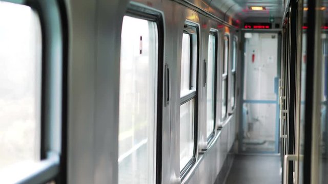 Empty corridor in the train cabin while traveling in 4k slow motion 60fps