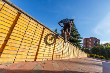 professional BMX rider made tricks on bicycle 
