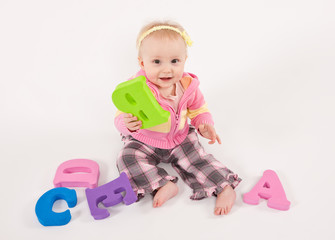 Baby playing  with alphabet letters