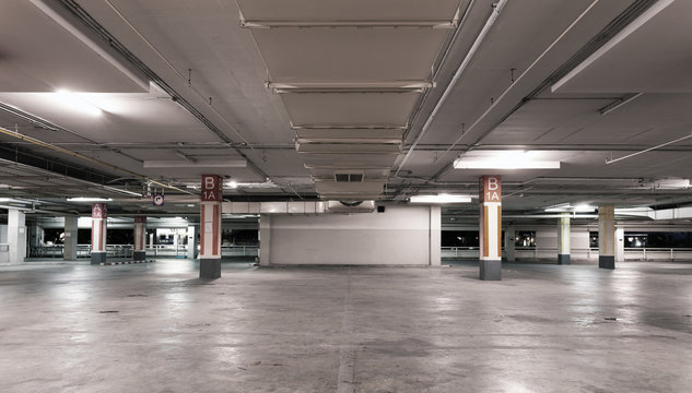Empty modern car parking garage interior background.