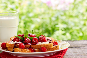 Sunmmer outdoor breakfast with toast and milk